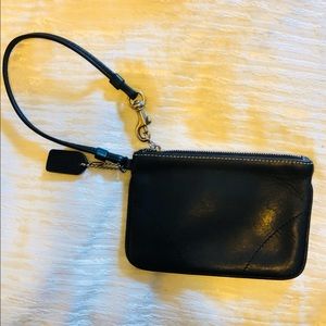 Coach black leather wristlet with silver accents